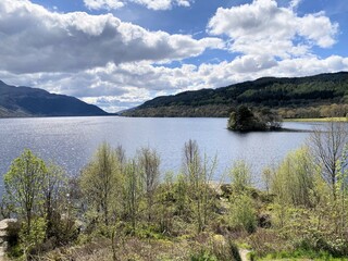 A view of Loch Lomond in Scotland on a sunny day