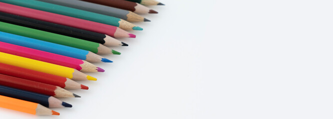 Colored pencils on a white background. Place for your text. Copy space. Mockup .