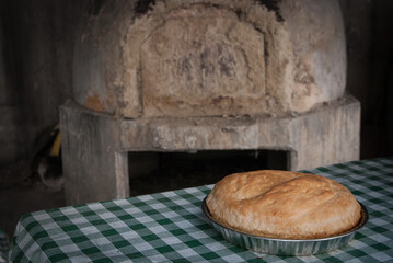 Fresh homemade bread cooked on a traditional clay oven.