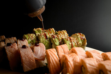 Green dragon rolls and unagi sauced fish fillet rolls ensemble.