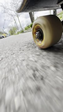  View under skateboard close up pov. Skateboard whell