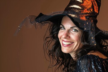 smiling woman in witch costume