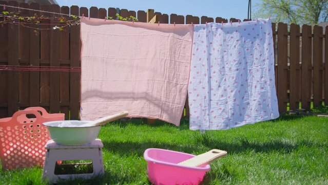 Washing clothes on old vintage washboard outdoors. Wide shot of decoration