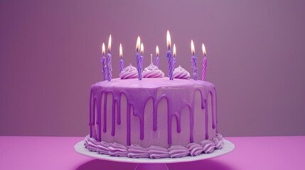   A birthday cake with purple icing and lit candles on a purple cake stand against a pink table, backed by a purple background