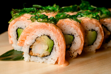 Salmon rolls with nori in a diverse sushi selection