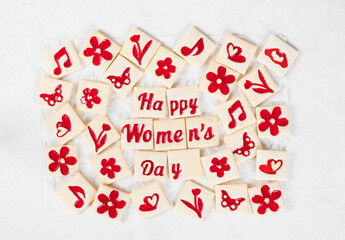 Women's Day cookies. Cute delicate square cookies with marmalade filling of a thematic shape: Happy Women's Day, flower, heart, butterfly, notes. Top view