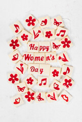 Women's Day. Modern delicate square cookies with marmalade filling of a thematic shape: Happy Women's Day, flower, heart, butterfly, notes. Top view