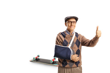 Elderly man with a broken arm injured from a skateboard fall gesturing thumbs up