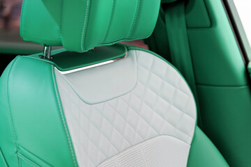 Luxury car green leather seats. Interior of new modern clean expensive car. Close-up details