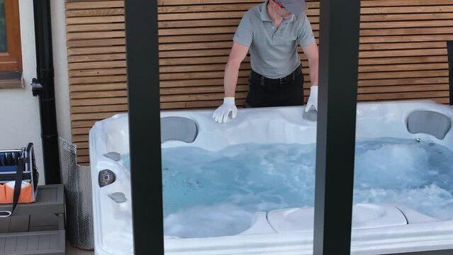 Man Cleaning Hot Tub