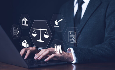 Businessman or Lawyer working with legal services icons on a laptop virtual screen can legal advice...
