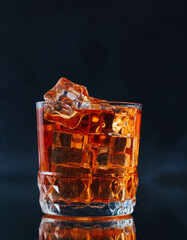 glass of whiskey with ice