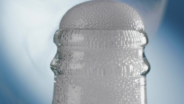  fizzing opening of  a soda bottle