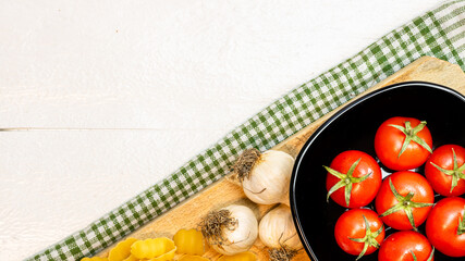 Beautiful tasty Italian pasta, tomatoes, onions and garlic for cooking pasta