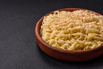 Delicious Asian dish rice noodles or udon with vegetables, spices and herbs