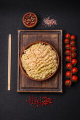 Delicious Asian dish rice noodles or udon with vegetables, spices and herbs