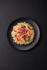 Delicious Asian dish rice noodles or udon with vegetables, spices and herbs