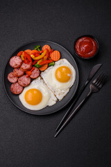 Delicious nutritious breakfast with fried eggs, sausage, steamed vegetables