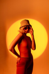 Fashionable portrait of blonde lady in sunglasses posing. 