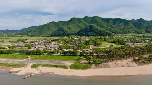 South Korea, North Gyeongsan Province, Andong, Hahoe Traditional Folk Village, panoramic view of the village and the river going round it