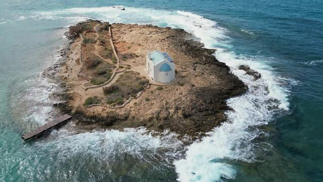 Aerial view, small island with a church. Afentis Christos Chapel. Malia, Crete,  Greece, Mediterranean.