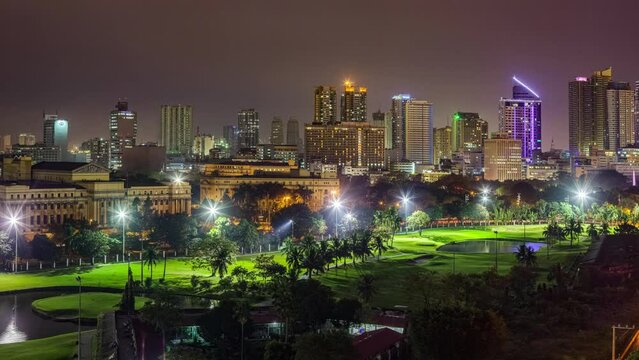 Philippines, Metro Manila, Intramuros, view from the Bayleaf Hotel, elevated panoramic view of Museum of Fine Arts buildings, in front of Club Intramuros Golf Course, illuminated at night