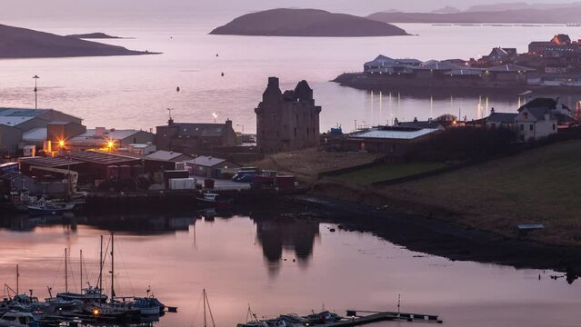 United Kingdom, Scotland, Shetland Islands, Mainland, Scalloway, elevated panoramic view of the harbour at sunset