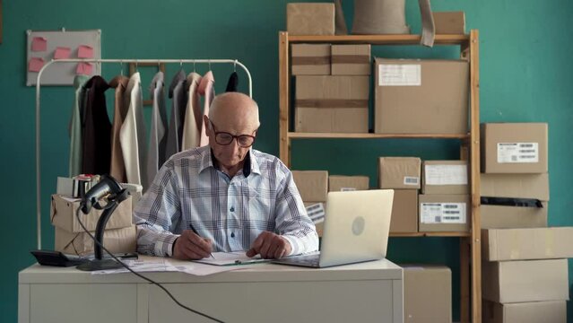 SME and e-commerce. Start-up, small businesses SME owner male entrepreneurs to receive and review orders online to pack boxes, sell to customers.
