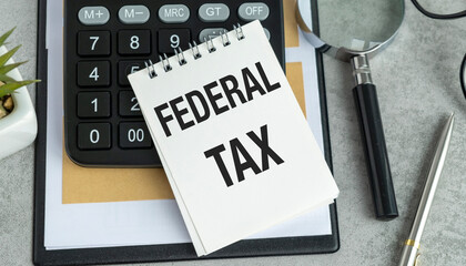 FEDERAL TAX text, inscription with calculator and magnifying glass. Federal tax word, financial...