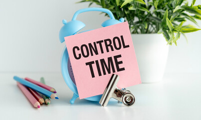 Control Time text on white background near blue alarm clock.