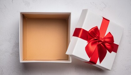open white gift box with lid and red bow cut out on white background present box top view