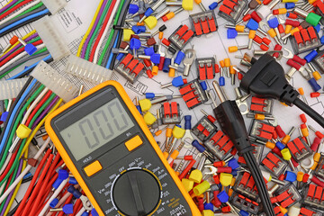 A digital multimeter for measuring the parameters of electrical circuits in an electrical diagram....