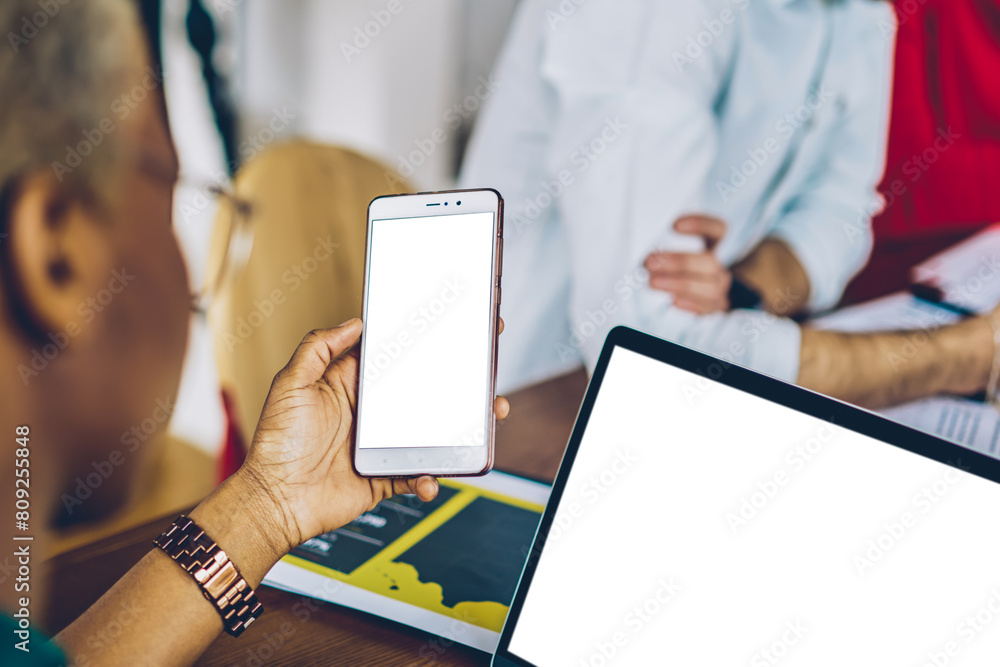 Poster cropped view of dark skinned young woman holding modern smartphone with blank screen and sharing med