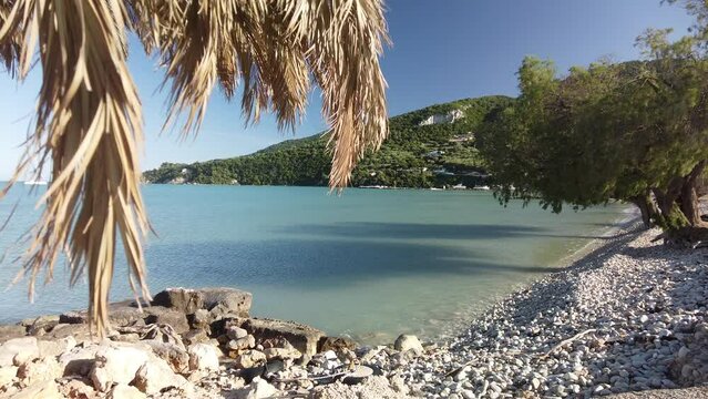 beach of Limni Keriou withe Marathonisi island in the background