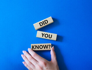 Did you know symbol. Wooden blocks with words Did you know. Businessman hand. Beautiful blue...