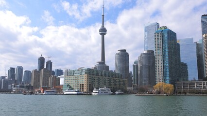 Naklejka premium View over the Toronto skyline from lake Ontario - TORONTO, CANADA - APRIL 15, 2024