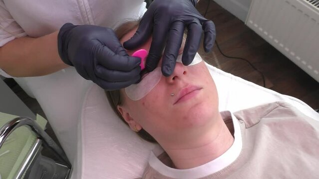 Master Glues Eyelashes To Lash Silicone Roller By Applicator. Eyelash Care Treatment: Eyelash Lifting, Curling, Lash Lamination, Extension. Nourishing With Keratin And Vitamin Horizontal, Slow Motion