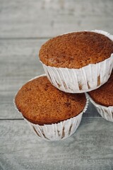 Close up top view of freshly baked muffins on the table.