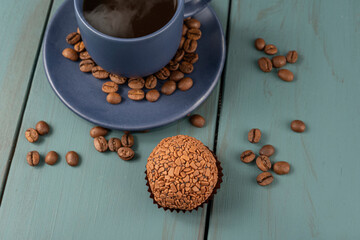 Brazilian fudge ball, traditional Brazilian sweet, next to cup and coffee beans_7.