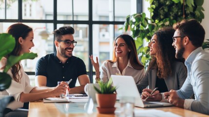 A group of five business professionals are sitting around a table having a meeting