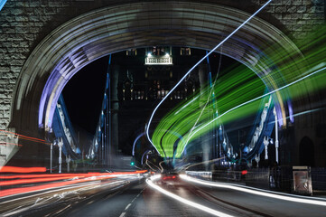 Light trails of passing cars on Tower bridge in London