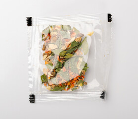 Small Spice Pouch Isolated, Dried Vegetables and Herbs Mix in Plastic Bag, Dry Peas, Greens, Dehydrated Food