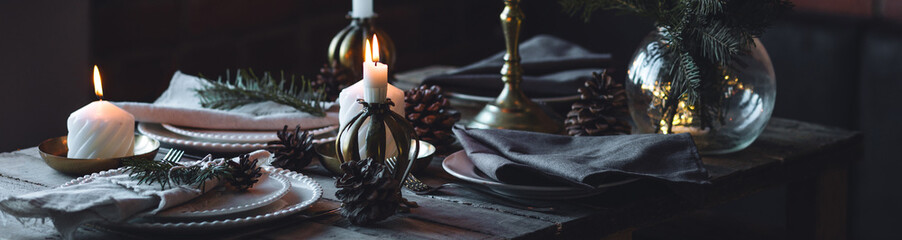 Banner. Beautiful table setting for family Christmas dinner at home. Cozy atmosphere, candlelight....
