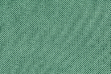 Plain green velor upholstery fabric, jacquard with fine diamond texture background. Close up, macro...