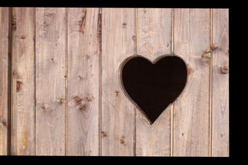 Heart carved into a wooden board
