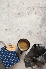 Happy Fathers Day vertical banner design with shopping bag, coffee cup, necktie on stone table.