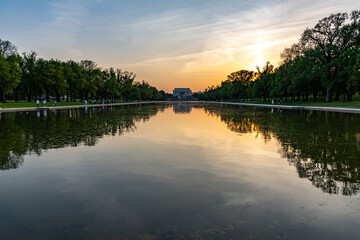 Sunset in reflecting pool and Lincoln monument, located in Washington, DC