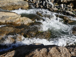 water flowing over rocks in the river