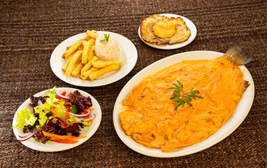 Baked onion trout fillet - Rainbow trout from Tota Boyaca lake. Colombian gastronomy