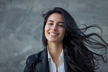 Happy businesswoman with long black hair - Powered by Adobe